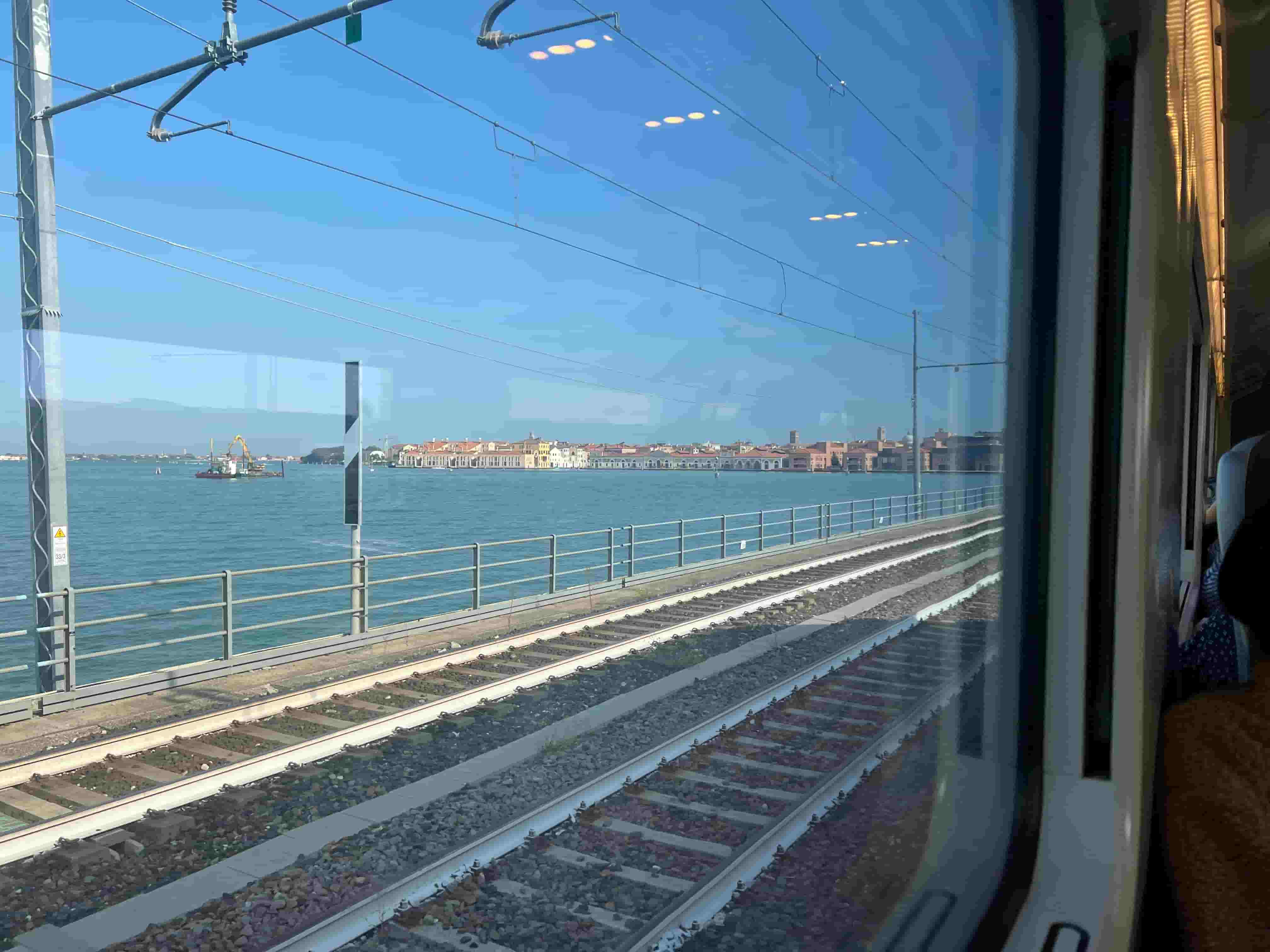 View from train window on a train between Venice and Rome in Italy
